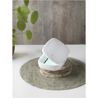 Logotrade advertising products photo of: Capsule UV smartphone sanitizer with 5W wireless charging pad